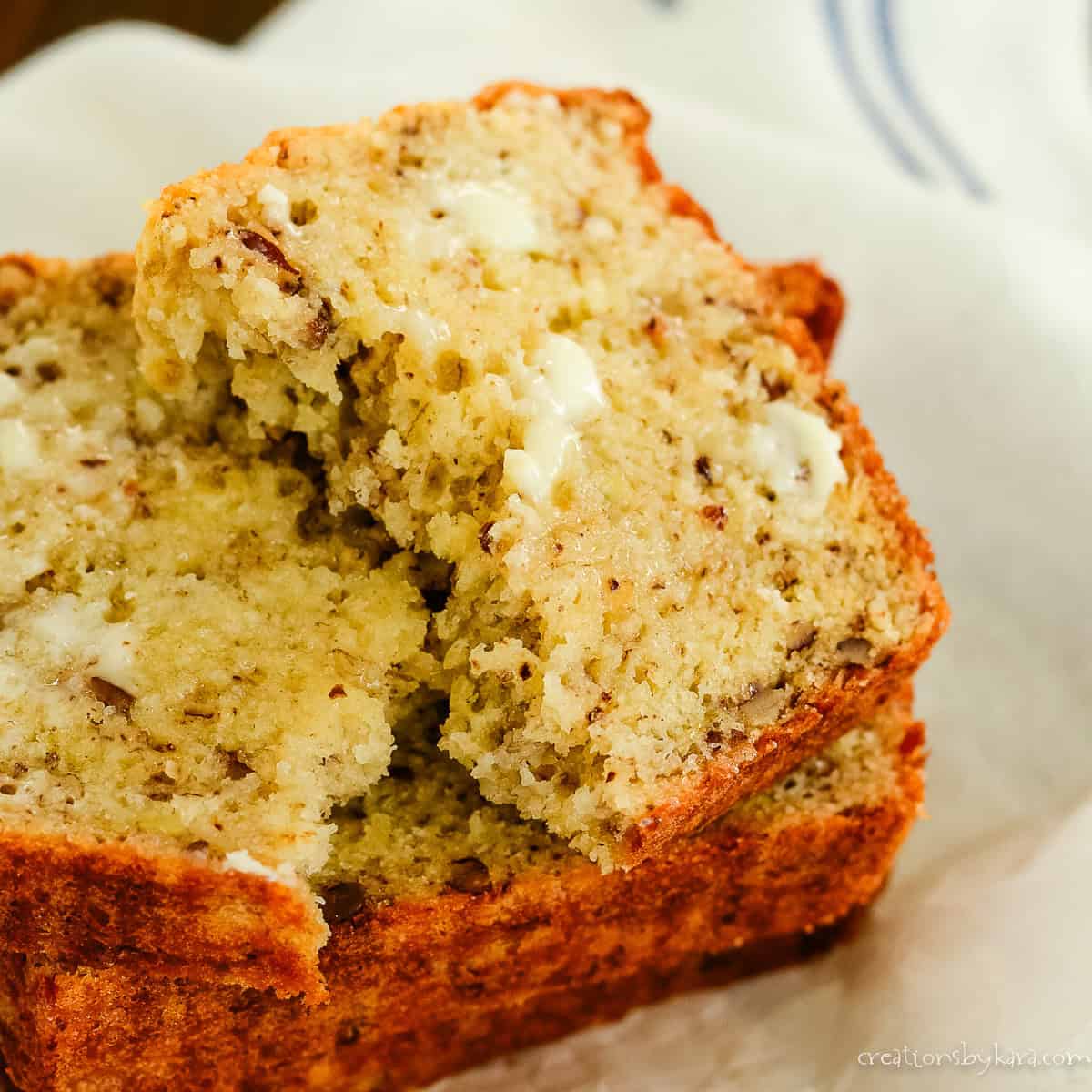 slice of 2 banana banana bread with butter