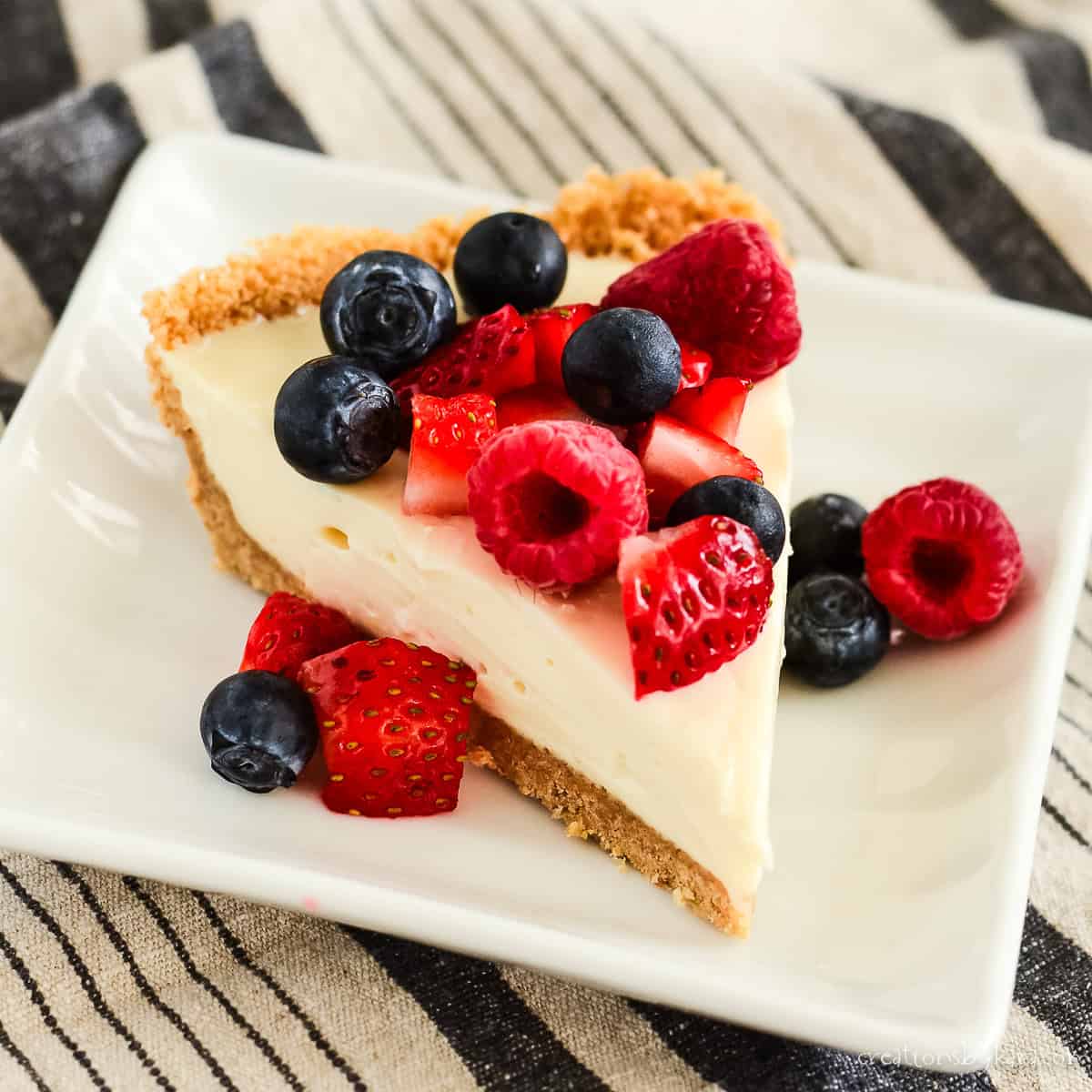 sweetened condensed milk cheesecake with fresh berries