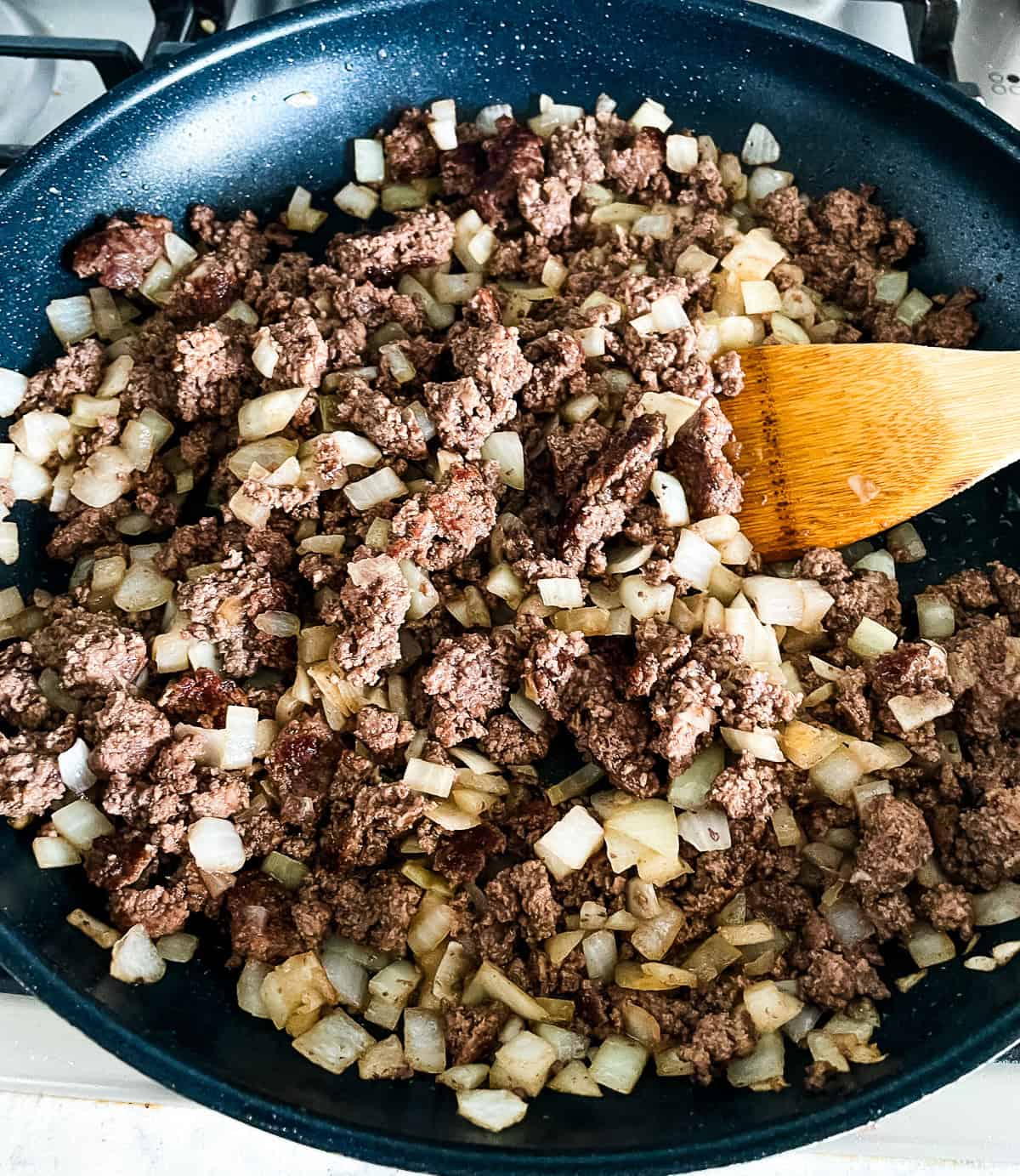 ground beef and onion in a skillet