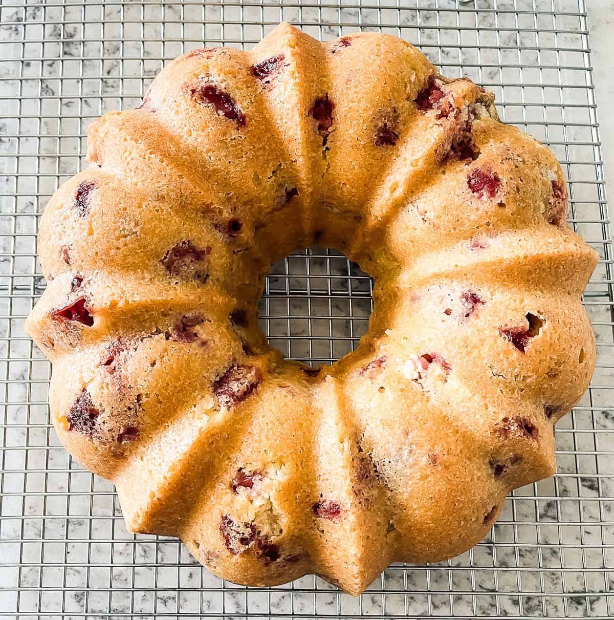 strawberry lemonade bundt cooling on wire rack
