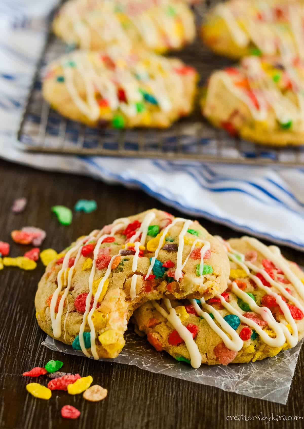 stacked cookies with a cooling rack of cookies in the background