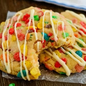 2 fruity pebbles cookies, one with a bite taken out of it